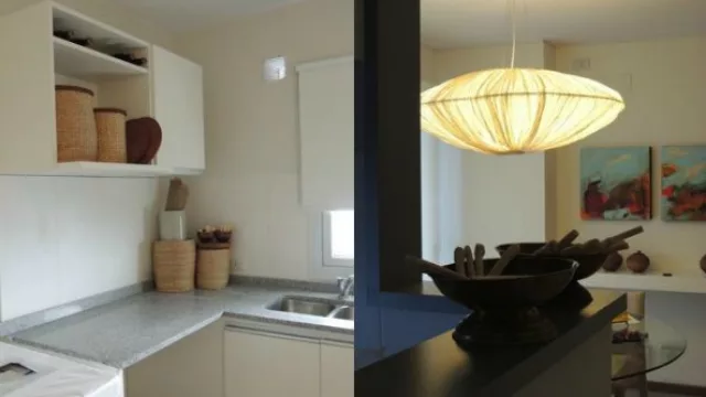  La cocina dividida por paredes cuenta con un desayunador que conecta con el living. 