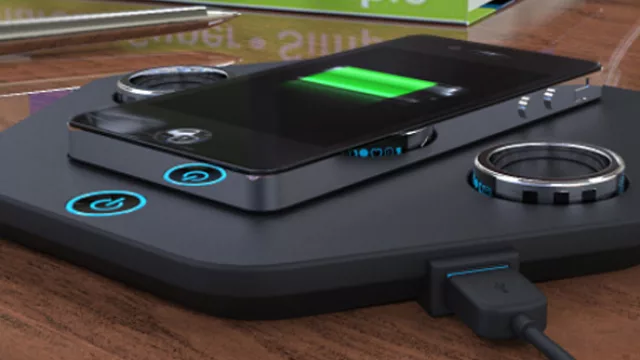 El cargador inalámbrico para un par de anillos y el teléfono