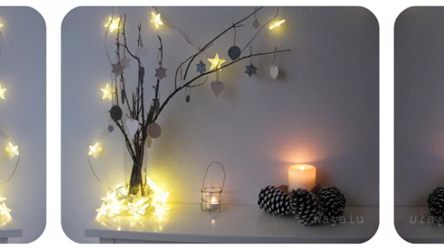 Árbol luminoso con ramas, luces y cartelitos en cartón decorado.